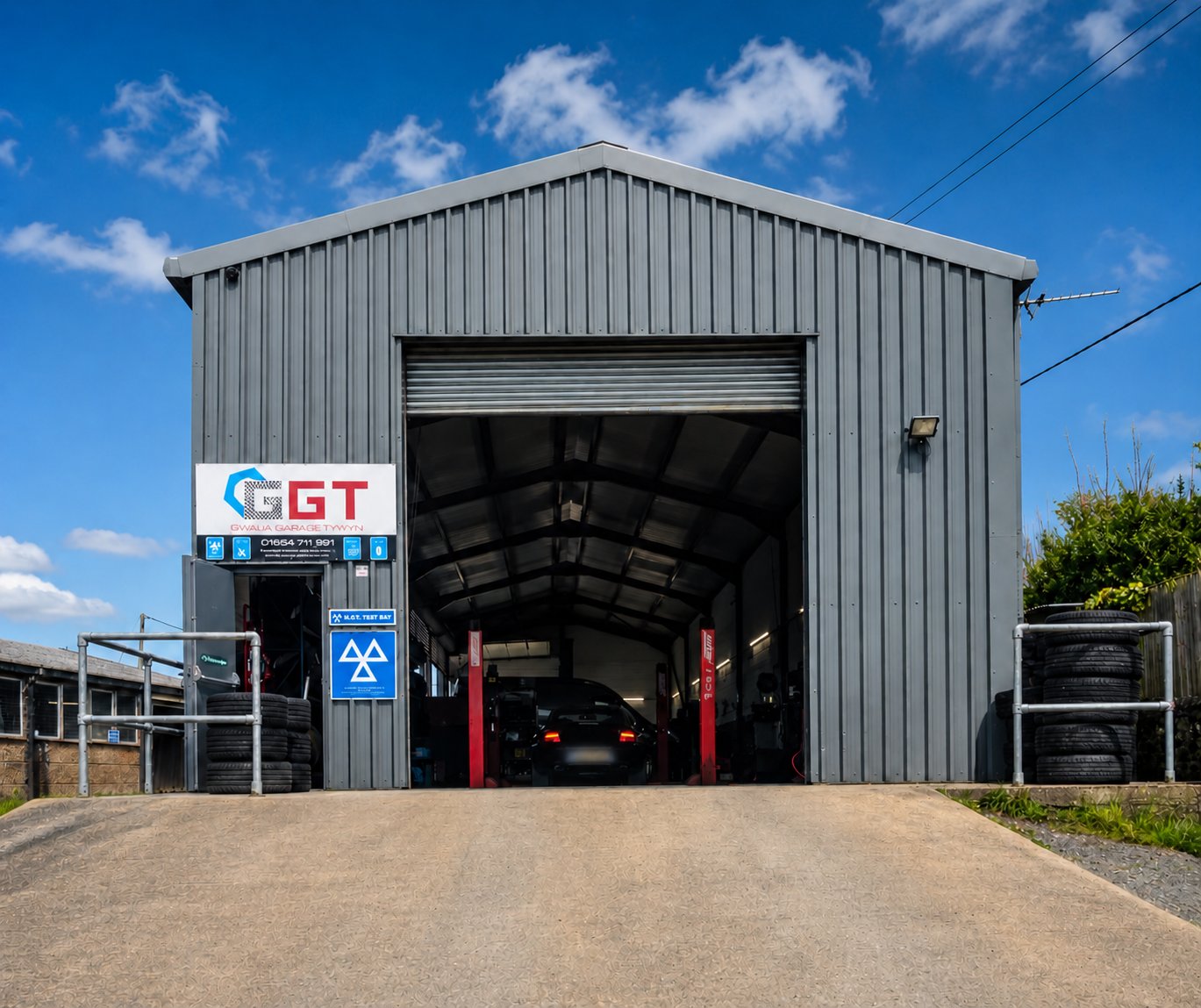 BMW on precision 4-wheel alignment equipment at Modurol Dyfi garage Tywyn — tyre and alignment service Gwynedd